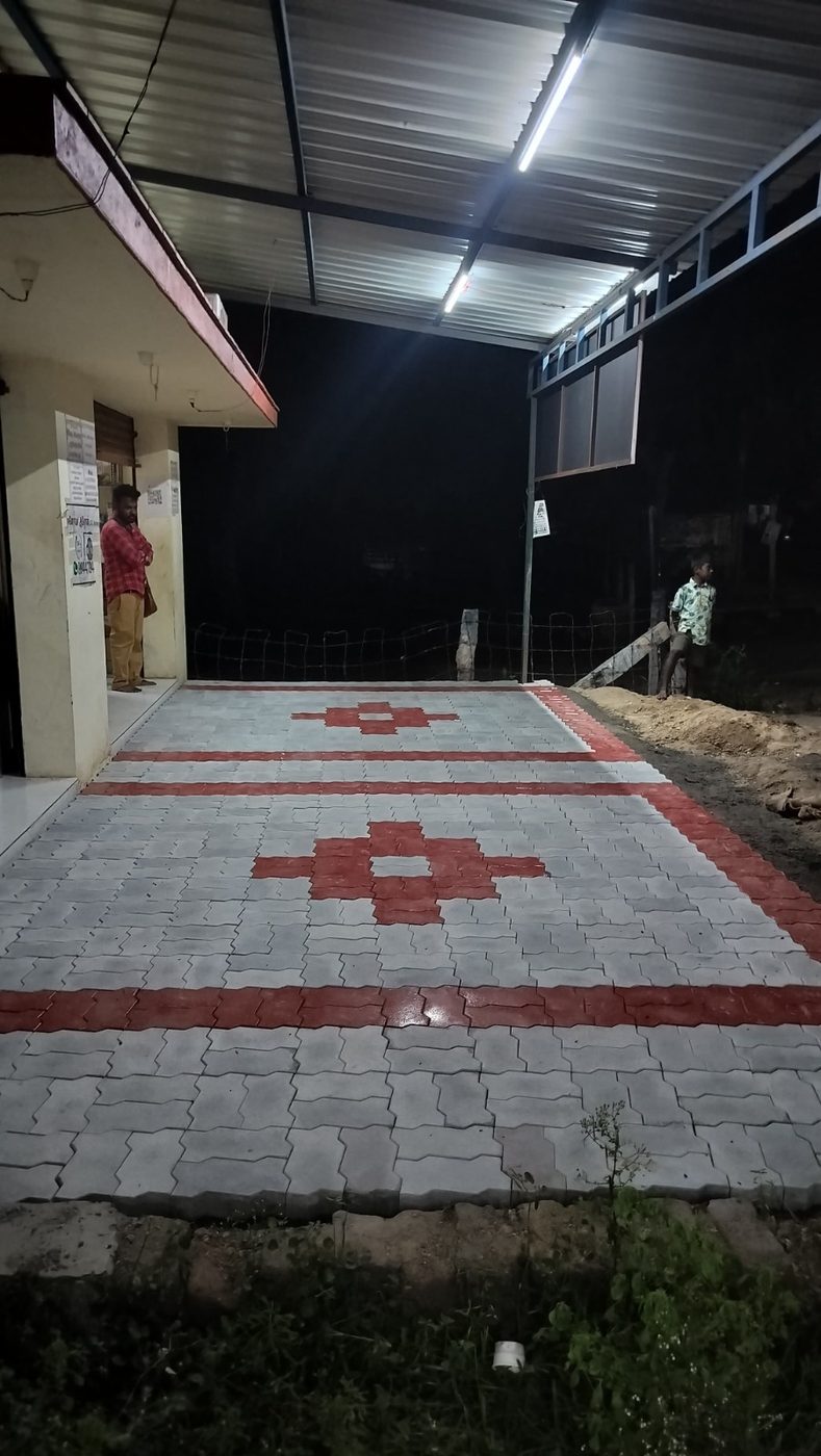 Forecourt with grey and red zigzag paver blocks